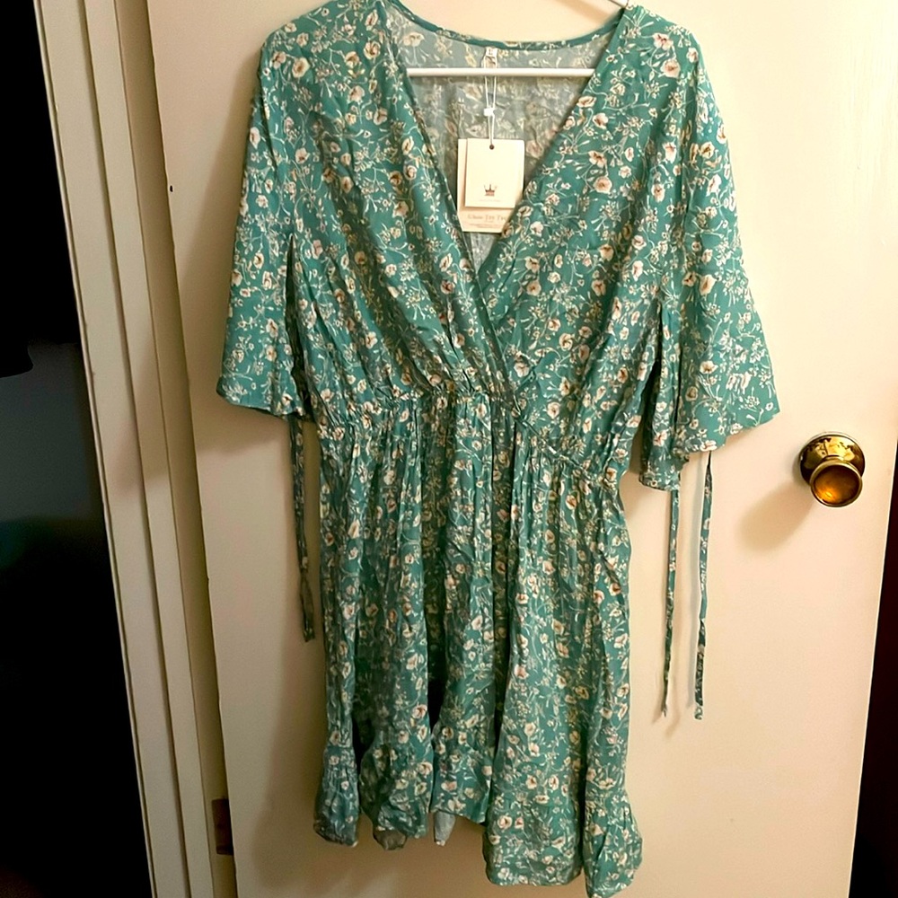 Dress, falls beneath the knees.